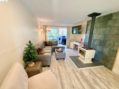 Townhome living on the golf course! Nestled within the gated