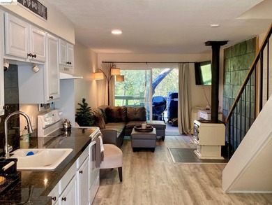 Townhome living on the golf course! Nestled within the gated