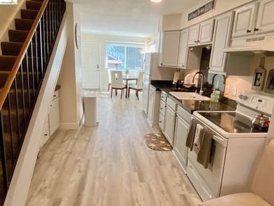 Townhome living on the golf course! Nestled within the gated