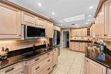 This sprawling brick ranch features a stunning open floor plan - photo 6