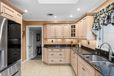This sprawling brick ranch features a stunning open floor plan - photo 9