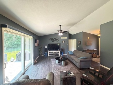 This 2016 ranch enjoys 300 feet of wooded creek frontage on just - photo 6