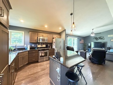 This 2016 ranch enjoys 300 feet of wooded creek frontage on just - photo 9