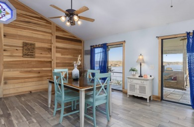 This charming two-story lake home offers stunning views and 1 - photo 9