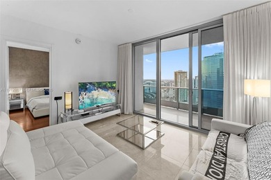 Live in the heart of Downtown Miami in this stunning 2 Bed + Den