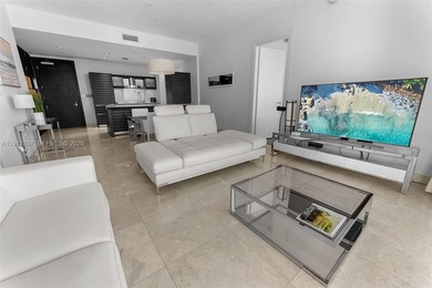 Live in the heart of Downtown Miami in this stunning 2 Bed + Den