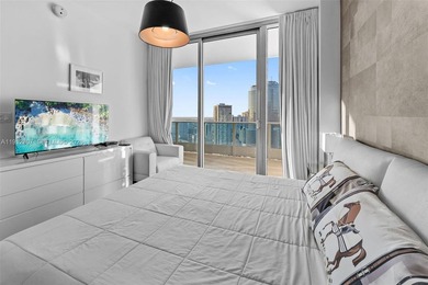 Live in the heart of Downtown Miami in this stunning 2 Bed + Den