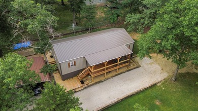 Escape to the lake with this charming 3-bedroom, 1.5-bath cabin - photo 1