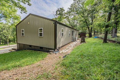 Escape to the lake with this charming 3-bedroom, 1.5-bath cabin - photo 7