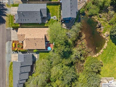 Rockaway Beach home on quiet street backs up to a pond to take - photo 3