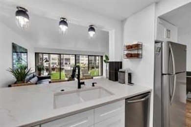 THIS STUNNING GROUND FLOOR UNIT HAS BEEN TOTALLY RENOVATED IN