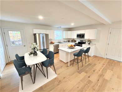 This charming two-story Cape-style duplex condo features an open - photo 4