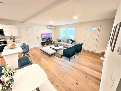 This charming two-story Cape-style duplex condo features an open - photo 5