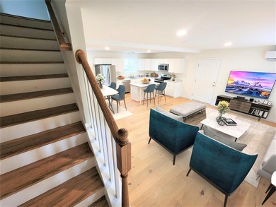 This charming two-story Cape-style duplex condo features an open - photo 6