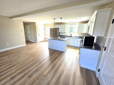 This charming two-story Cape-style duplex condo features an open - photo 9