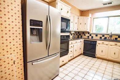 Lakefront classic! Brick ranch style home is ready for