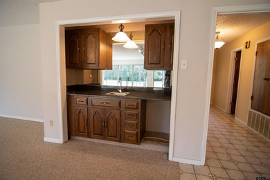 Lakefront classic! Brick ranch style home is ready for