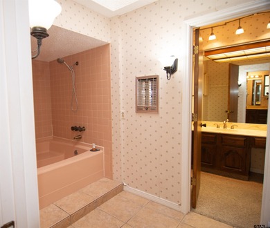 Lakefront classic! Brick ranch style home is ready for