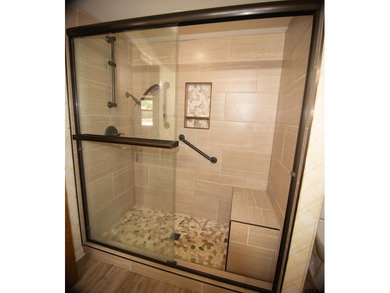 Lakefront classic! Brick ranch style home is ready for