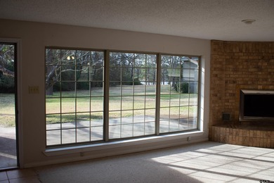 Lakefront classic! Brick ranch style home is ready for