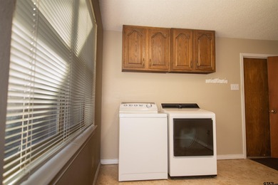 Lakefront classic! Brick ranch style home is ready for