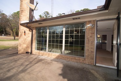 Lakefront classic! Brick ranch style home is ready for