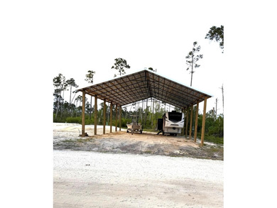 This 1 acre lot is only 4 miles from the beautiful white sands - photo 1