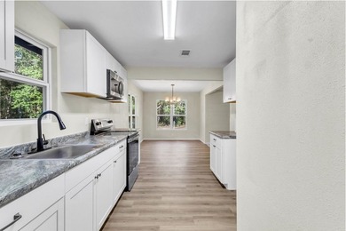 Discover your newly remodeled retreat in the coveted *Land of - photo 15