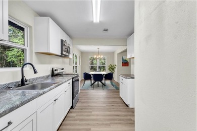 Discover your newly remodeled retreat in the coveted *Land of - photo 26