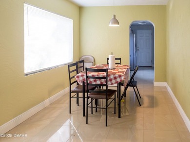 This cozy 3-bedroom, 1-bathroom concrete block home sits on a - photo 3