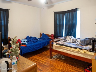 This cozy 3-bedroom, 1-bathroom concrete block home sits on a - photo 6