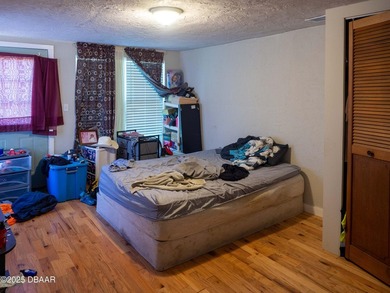This cozy 3-bedroom, 1-bathroom concrete block home sits on a - photo 9