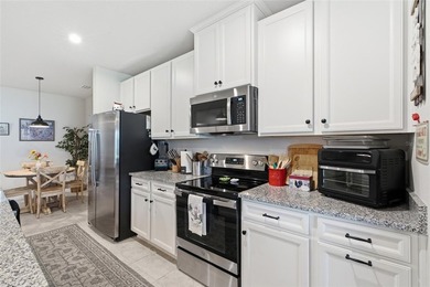 Experience low-maintenance living in this partially furnished - photo 4