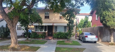 Discover the potential of this Duplex located at 411 E 8th - photo 1