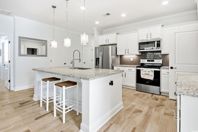 Welcome to this must see four bedroom, three and a half bath