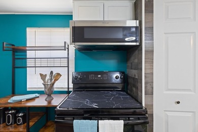 **Price Improvement** Kitchen-First Coastal Living. Step inside - photo 21