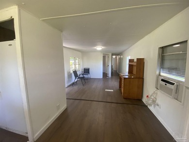 This corner lot property includes a mobile home featuring 2 - photo 11