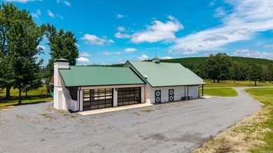 Private barndominium retreat on approximately 71 acres behind a - photo 4