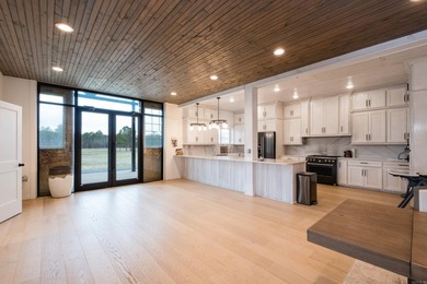 Private barndominium retreat on approximately 71 acres behind a - photo 6