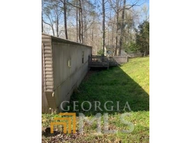 ALMOST 1 ACRE DEEDED LOT ON JACKSON LAKE! SINGLEWIDE MOBILE HOME - Lake Home For Sale in Mansfield, Georgia