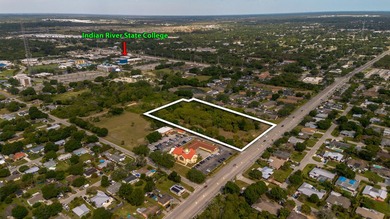 This prime 4.87-acre parcel is strategically located in a highly - photo 1