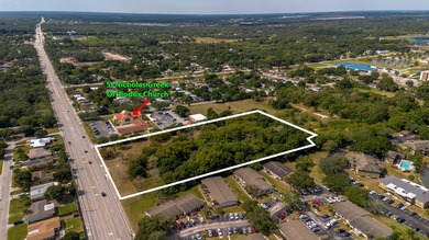 This prime 4.87-acre parcel is strategically located in a highly - photo 2