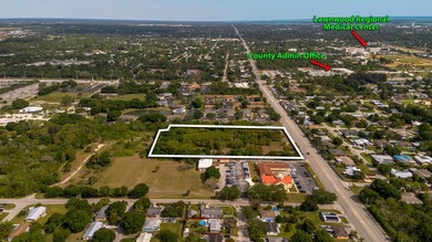 This prime 4.87-acre parcel is strategically located in a highly - photo 3