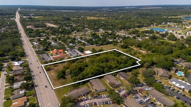 This prime 4.87-acre parcel is strategically located in a highly - photo 6