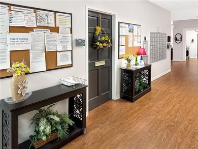 WALK-IN TUB and gleaming hardwoods and washer/dryer in unit in