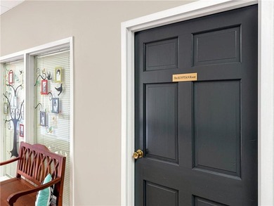 WALK-IN TUB and gleaming hardwoods and washer/dryer in unit in