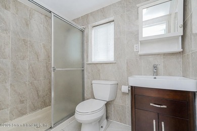 Welcome to this well-maintained single-family semi-attached home - photo 12