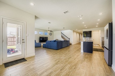 This like new, barely lived in smart home, features an open - photo 8