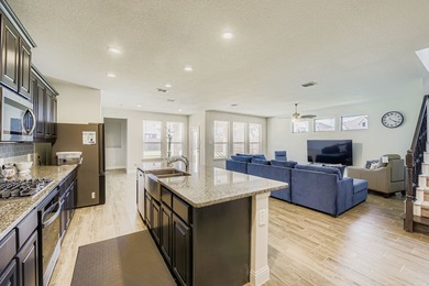 This like new, barely lived in smart home, features an open - photo 9