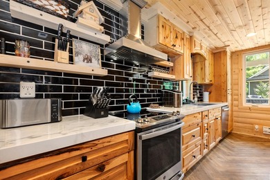 Enjoy peaceful lake living w/ 150' of frontage on private 9-acre - photo 10